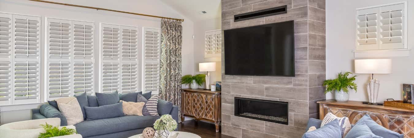 Interior shutters in Bowie family room with fireplace